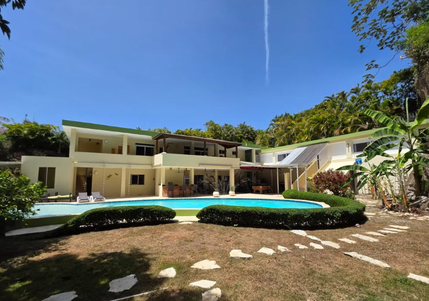 Luxury villa with pool and lush tropical landscaping