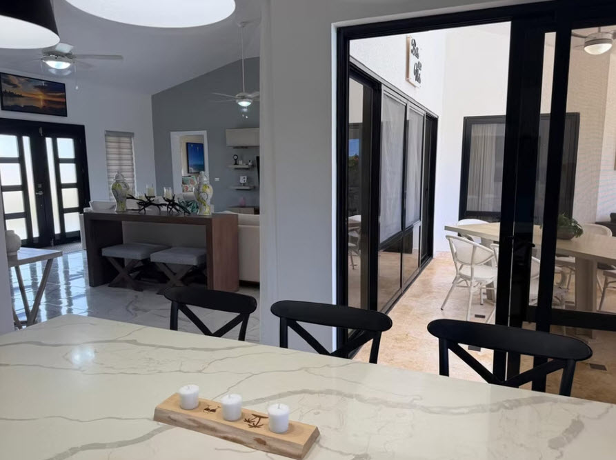 Modern open-plan living and dining area with contemporary furniture and decor.