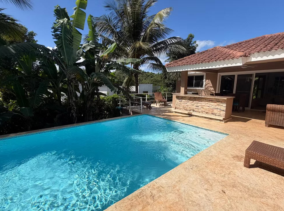 Luxury tropical villa with a private pool and outdoor bar in the Caribbean.