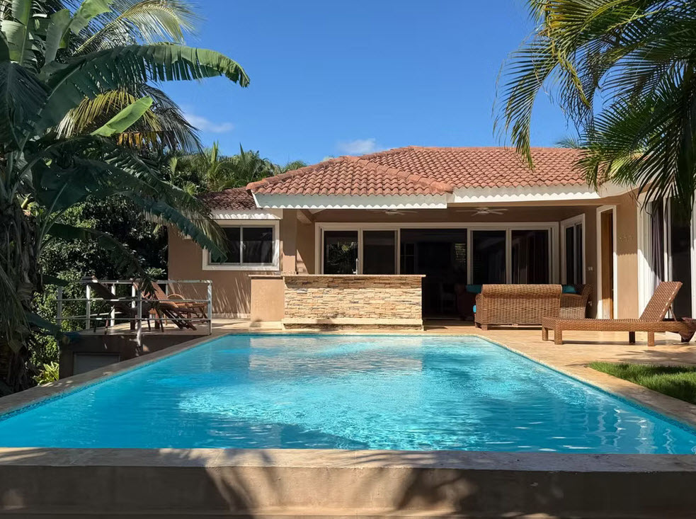 Luxury villa with private pool and tropical palm trees