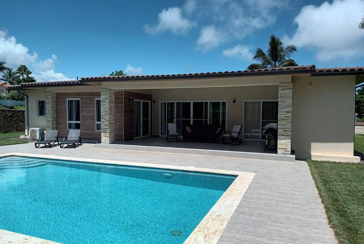 Modern house with swimming pool and outdoor patio furniture