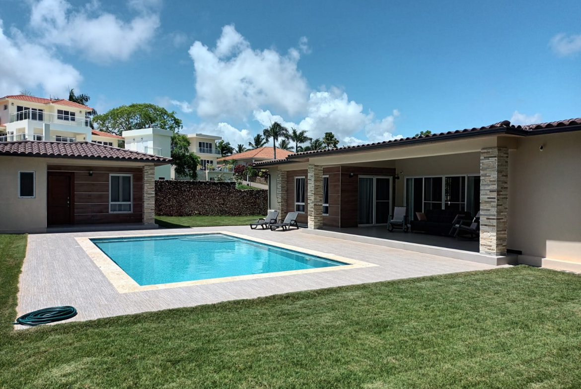 Modern luxury villa with swimming pool and outdoor lounge area