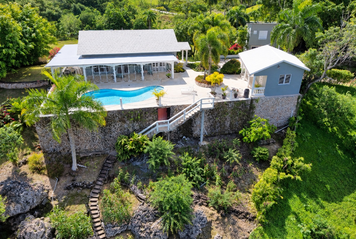 Luxury villa with a swimming pool and lush tropical landscaping